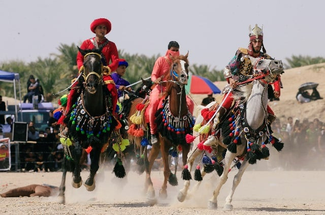 local actors dressed as ancient warriors re enact a scene from the 7th century battle of karbala to commemorate ashura in najaf photo reuters