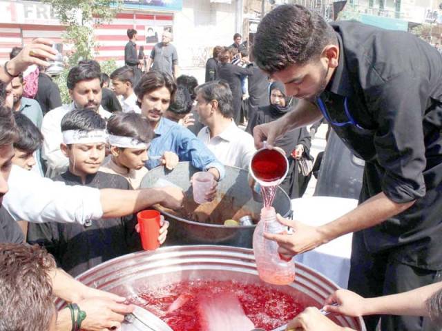 a volunteer distributes sherbet from a sabeel in peshawar photo online a volunteer distributes sherbet from a sabeel in peshawar photo online
