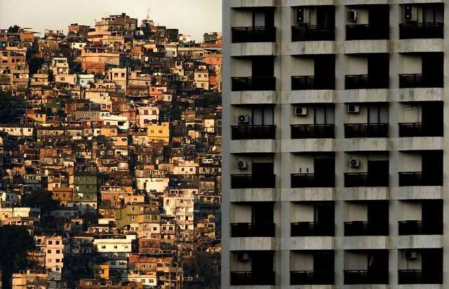 view of rocinha l favela in the background of a building of sao conrado neighborhood the closest and one of the richest areas of rio de janeiro brazil photo afp view of rocinha l favela in the background of a building of sao conrado neighborhood the closest and one of the richest areas of rio de janeiro brazil photo afp