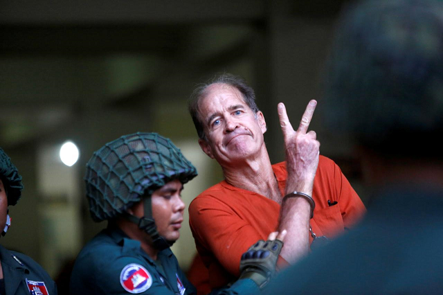 australian filmmaker james ricketson gestures as he leaves the municipal court of phnom penh cambodia august 16 2018 photo reuters