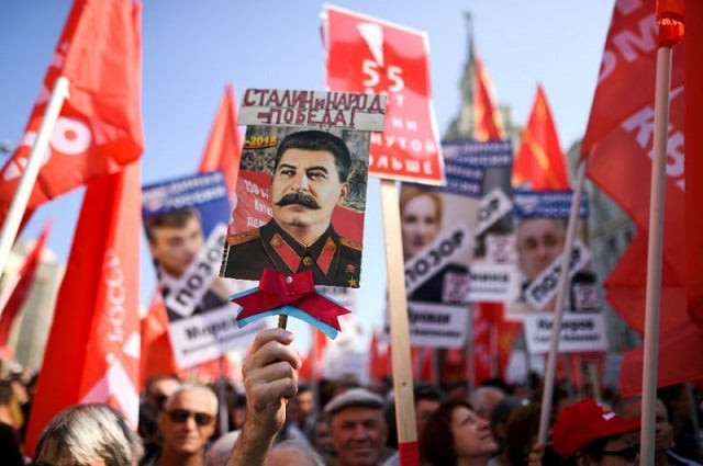 russian communist party supporters carry the portrait of former soviet leader josef stalin at a rally in moscow on sunday against the government 039 s pension reform photo afp russian communist party supporters carry the portrait of former soviet leader josef stalin at a rally in moscow on sunday against the government 039 s pension reform photo afp