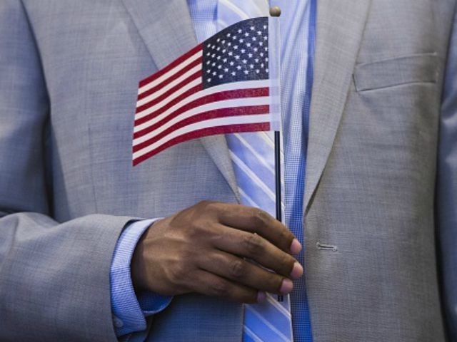 a us immigrant holds the american flag photo afp