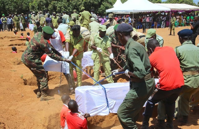 tanzania security forces bury the coffins the victims of a ferry accident during the burial service at the shore of lake victoria at ukara ukerewe district mwanza region photo afp