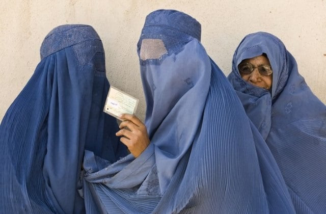 an afghan woman shows her identity card after casting her vote at a polling centre in herat western afghanistan august 20 2009 photo reuters file an afghan woman shows her identity card after casting her vote at a polling centre in herat western afghanistan august 20 2009 photo reuters file