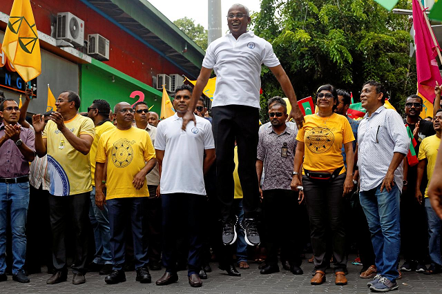 ibrahim mohamed solih maldivian presidential candidate backed by the opposition coalition jumps next to his supporters during the final campaign rally ahead of the presidential election in male maldives september 22 2018 photo reuters