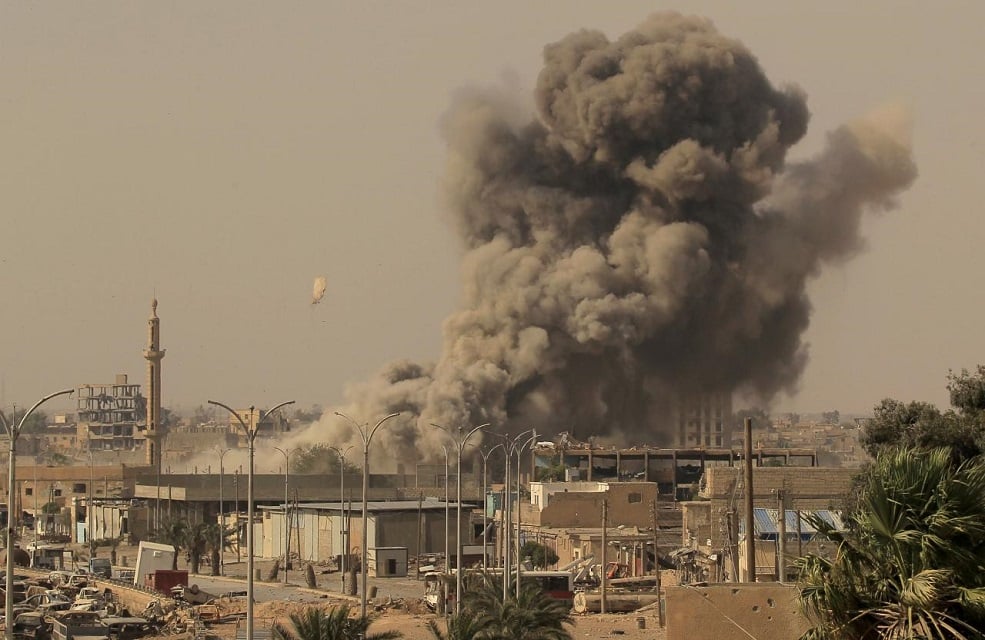 smoke rises after an air strike in raqqa syria photo reuters