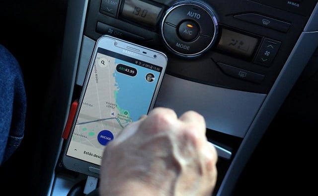 uber driver juan carlos who wished not to give his last name uses his application map on his cellphone as he drives his car in buenos aires argentina september 19 2018 picture taken september 19 2018 photo reuters