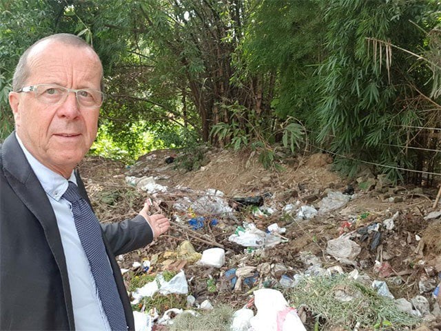 german ambassador points toward a dumpsite in sector f 7 photo twitter koblerinpak