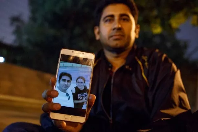 pakistani businessman mirza imran baig shows a picture of him and his wife mailikemu maimati as he sits outside the pakistani embassy in beijing china photo reuters pakistani businessman mirza imran baig shows a picture of him and his wife mailikemu maimati as he sits outside the pakistani embassy in beijing china photo reuters