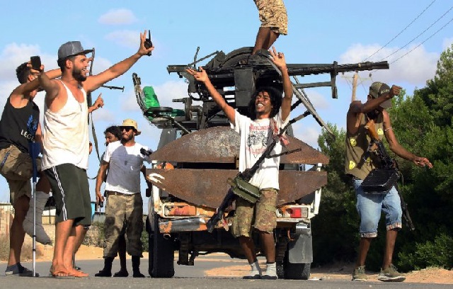 libyan militiamen loyal to the government of national accord gna libya 039 s internationally recognised government celebrate advances in the south of the capital tripoli photo afp