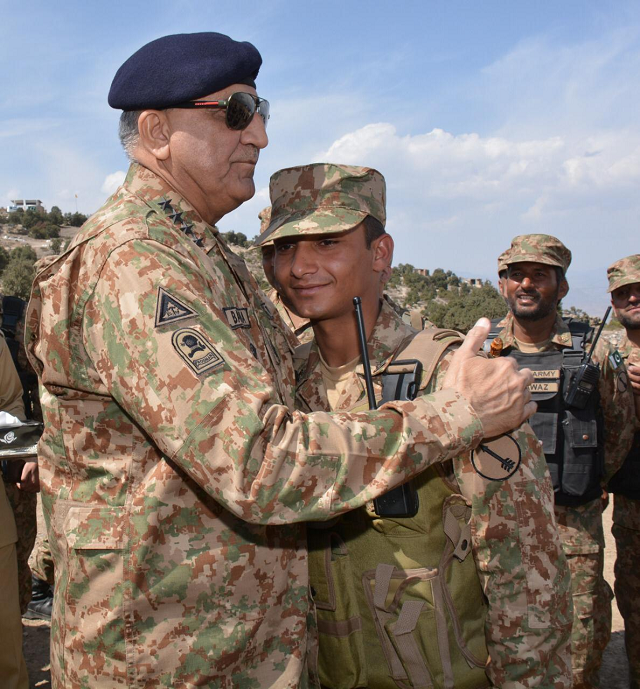 gen qamar embraces a soldier during his north waziristan trip photo ispr