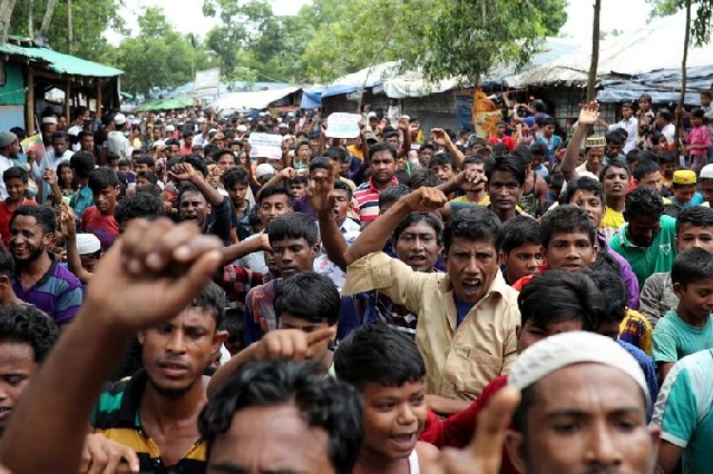 rohingya refugees shout slogans as they take part in a protest at the kutupalong refugee camp to mark the one year anniversary of their exodus in cox 039 s bazar bangladesh photo reuters
