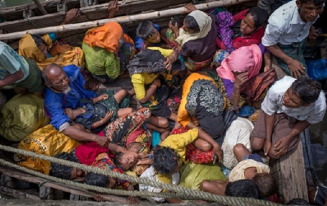rohingya refugees arriving on the bangladesh side of the naf river after fleeing violence in myanmar photo afp