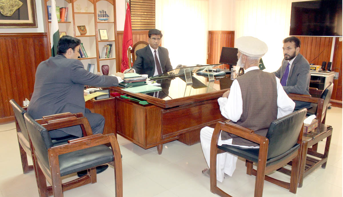 nab balochistan director general mirza muhammad irfan baig listens to a complainant at his office in quetta photo express