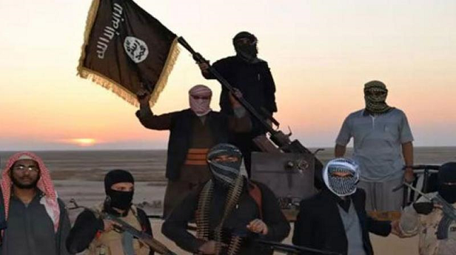 islamic state militants pose with the group 039 s flag photo afp