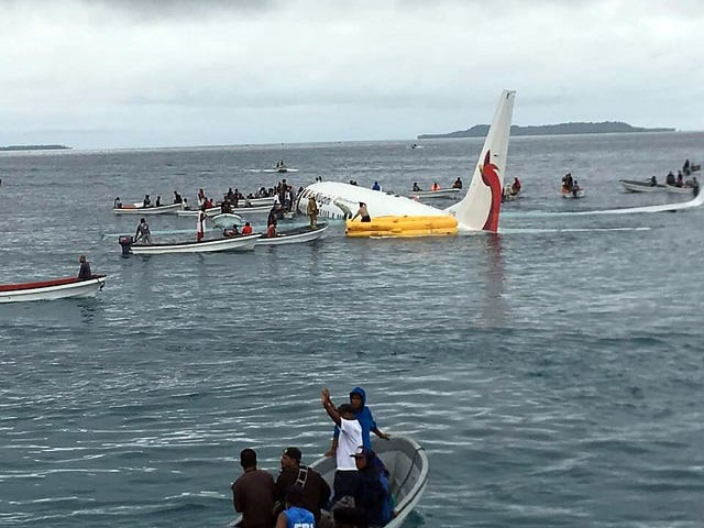 this picture taken by james yaingeluo on september 28 2018 shows locals approaching to rescue passengers of the crashed air niugini aircraft on the remote island of weno in micronesia an air niugini aircraft ditched into a lagoon after overshooting the runway on the remote island of weno but there were no serious injuries local media reports said photo afp this picture taken by james yaingeluo on september 28 2018 shows locals approaching to rescue passengers of the crashed air niugini aircraft on the remote island of weno in micronesia an air niugini aircraft ditched into a lagoon after overshooting the runway on the remote island of weno but there were no serious injuries local media reports said photo afp