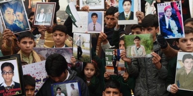 relatives of schoolchildren killed in a taliban attack on the army public school aps protest against delays in the investigation in peshawar photo afp