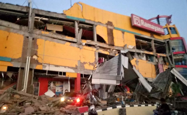 this handout photograph taken and released on september 28 2018 by indonesia 039 s national agency for disaster management bnpb shows a collapsed shopping mall in palu central sulawesi after a strong earthquake hit the area photo afp