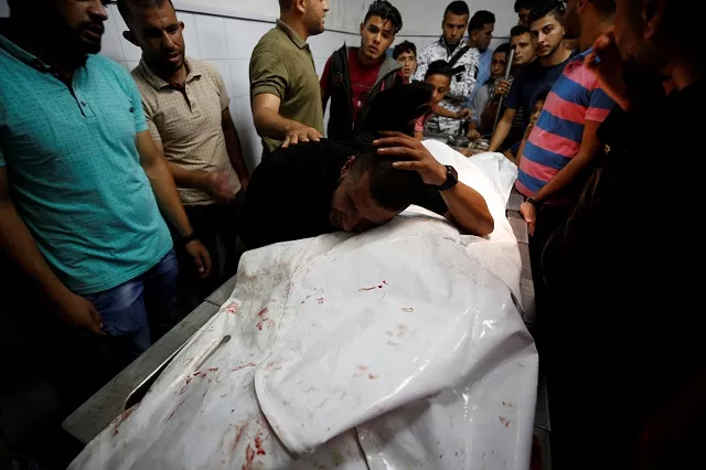 a relative reacts at the body of a palestinian who was killed during a protest at the israel gaza border fence in gaza city photo reuters a relative reacts at the body of a palestinian who was killed during a protest at the israel gaza border fence in gaza city photo reuters