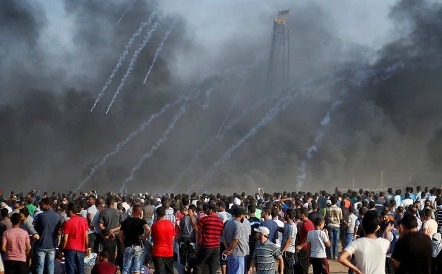 tear gas canisters are fired by israeli troops at palestinians during a protest calling for lifting the israeli blockade on gaza and demanding the right to return to their homeland at the israel gaza border fence east of gaza city september 28 2018 photo reuters tear gas canisters are fired by israeli troops at palestinians during a protest calling for lifting the israeli blockade on gaza and demanding the right to return to their homeland at the israel gaza border fence east of gaza city september 28 2018 photo reuters