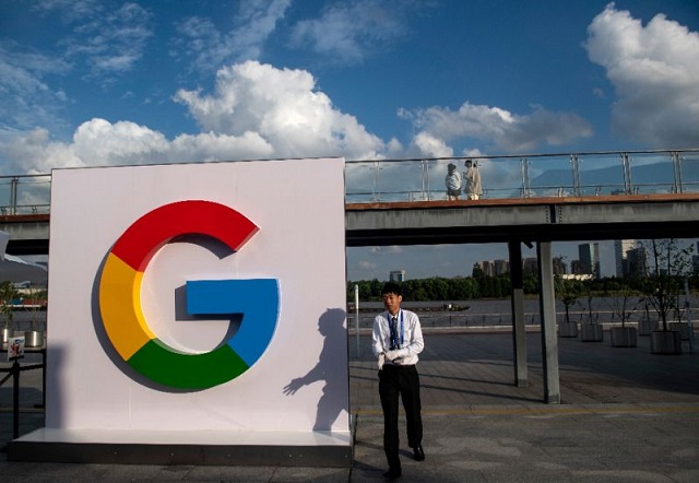 a man passes a google sign in shanghai on september 26 2018 photo apf