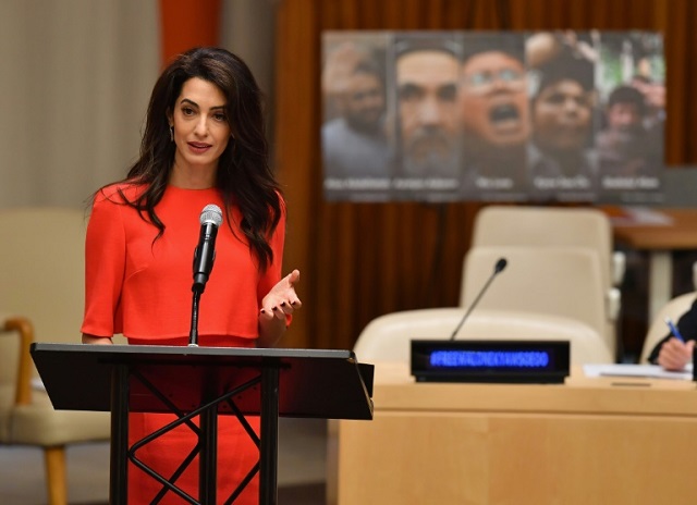 amal clooney appeals to suu kyi for reporters release