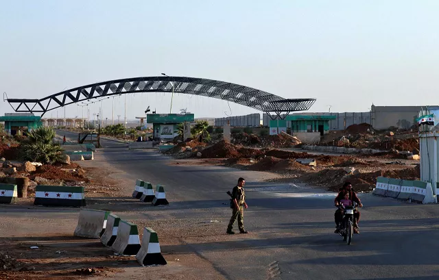 a man rides on a motorbike at the syrian jordanian border at the nasib crossing in deraa province syria august 27 2017 photo reuters a man rides on a motorbike at the syrian jordanian border at the nasib crossing in deraa province syria august 27 2017 photo reuters