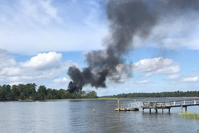 smoke rises at the site of a f 35 jet crash in beaufort south carolina u s september 28 2018 in this still image obtained from social media photo reuters