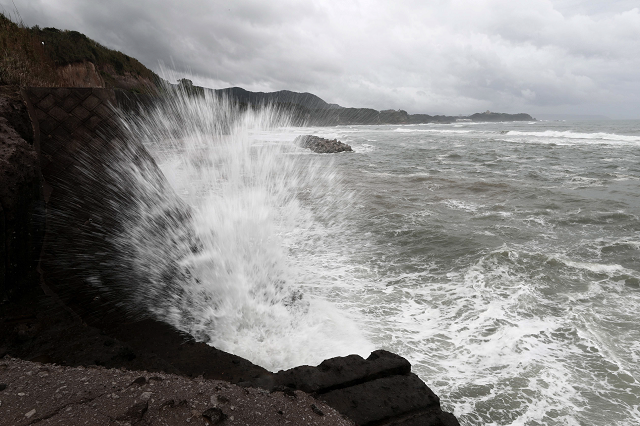 waves hit the seawalls at a coast of shibushi city kagoshima prefecture photo afp