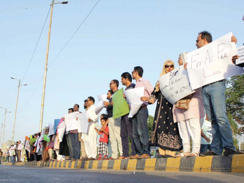 parents chanted slogans against the private schools calling them mafias and against the sindh government that failed to implement the shc s order photo athar khan express