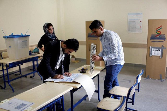 kurdish employees prepare at a polling station during parliamentary elections in the semi autonomous region in erbil iraq september 30 2018 photo reuters
