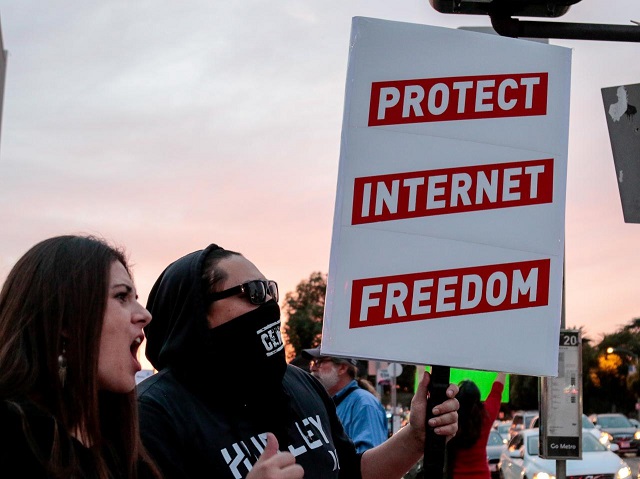 file photo supporters of net neutrality toyah and lance brown eyes protest the fcc 039 s decision to repeal the program in los angeles california november 28 2017 photo reuters