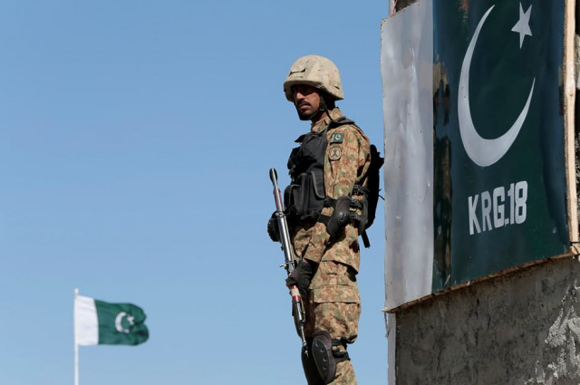 a soldier stands guard at the angoor adda outpost along the border fence on the border with afghanistan photo reuters file a soldier stands guard at the angoor adda outpost along the border fence on the border with afghanistan photo reuters file