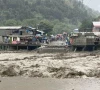 flash flood inundates mahabdri bazaar and munawar nullah damaging stores and goods in balakot travelers wait on kaghan highway after its closure by a landslide photos zulfiqar ali express