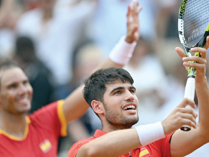 spain s carlos alcaraz r and rafael nadal celebrate their victory in the second round of the olympic men s doubles photo afp