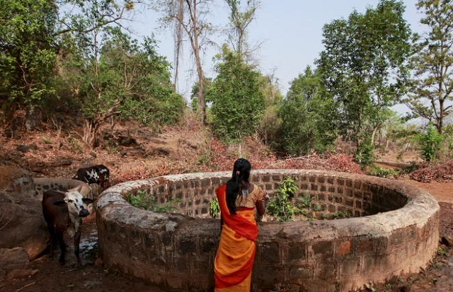a woman stands above a well photo reuters a woman stands above a well photo reuters
