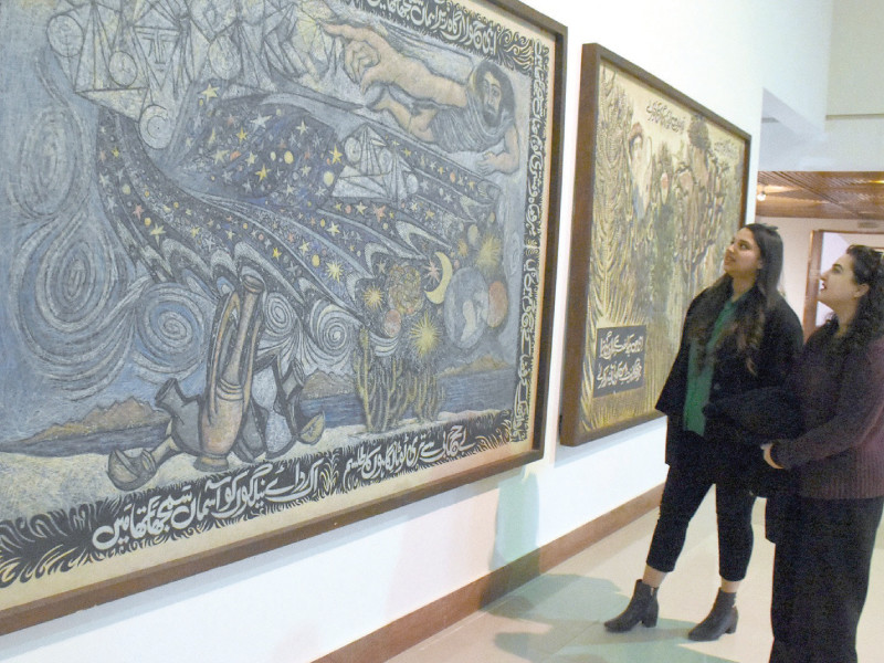 art enthusiasts explore a collection of paintings at the pnca in islamabad honouring the 38th death anniversary of legendary artist sadequain photo express