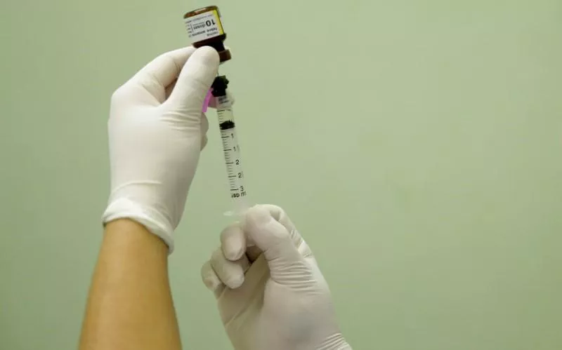 a health agent prepares a vaccine photo reuters a health agent prepares a vaccine photo reuters
