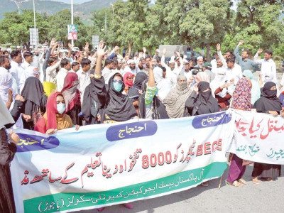 community schools unpaid for seven months teachers demand salaries