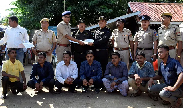 the rohingya men to be deported sit as indian and myanmar security officials exchange documents before their deportation on india myanmar border at moreh in the northeastern state of manipur india october 4 2018 photo reuters the rohingya men to be deported sit as indian and myanmar security officials exchange documents before their deportation on india myanmar border at moreh in the northeastern state of manipur india october 4 2018 photo reuters
