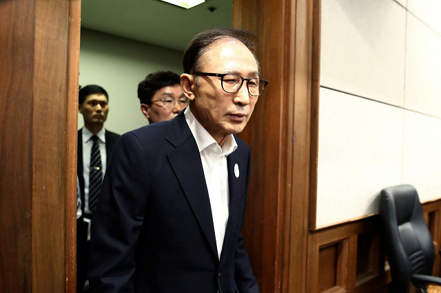 former south korean president lee myung bak appears for his first trial at the seoul central district court on may 23 2018 in seoul south korea photo reuters former south korean president lee myung bak appears for his first trial at the seoul central district court on may 23 2018 in seoul south korea photo reuters