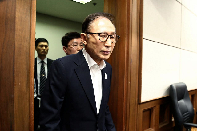 former south korean president lee myung bak appears for his first trial at the seoul central district court on may 23 2018 in seoul south korea photo reuters