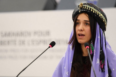 on her shoulders tells of painful burden carried by nobel winner on her shoulders tells of painful burden carried by nobel winner