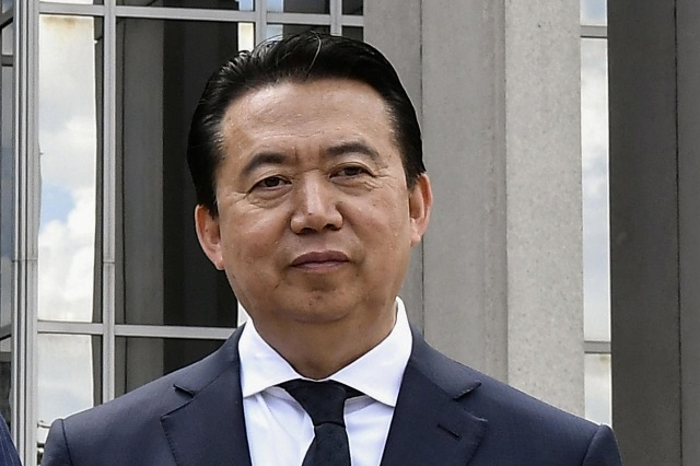 interpol president meng hongwei poses during a visit to the headquarters of international police organisation in lyon france photo reuters