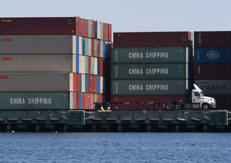 downgrade comes in the wake of rising trade tensions debt levels photo afp