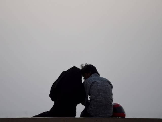 a young couple at karachi 039 s seaview beach photo file