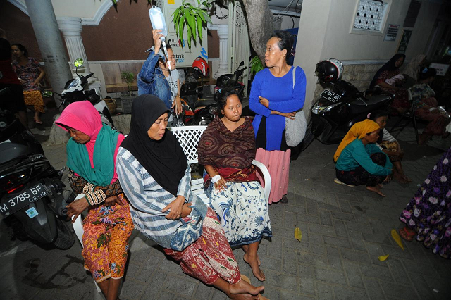patients sit at an open area after an earthquake at larasati hospital in pamekasan indonesia october 11 2018 photo reuters patients sit at an open area after an earthquake at larasati hospital in pamekasan indonesia october 11 2018 photo reuters