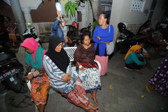 patients sit at an open area after an earthquake at larasati hospital in pamekasan indonesia october 11 2018 photo reuters