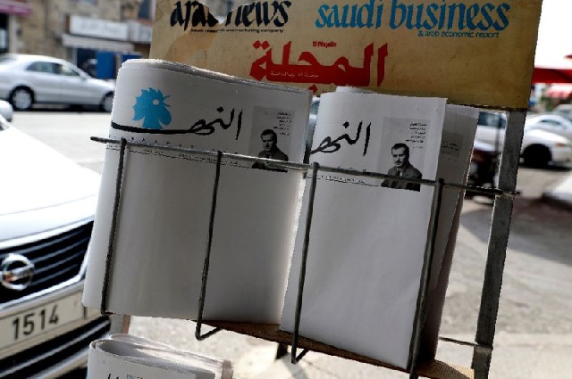 blank copies of lebanon 039 s leading newspaper an nahar are displayed on a newspaper stand in the coastal city of byblos north of beirut photo afp