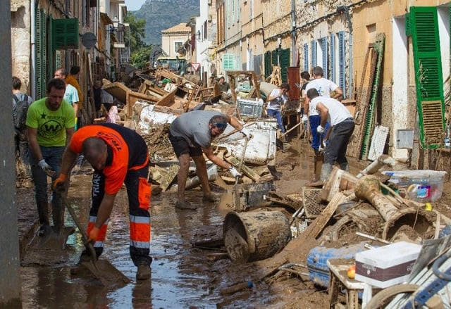 a massive clean up was under way thursday in the mud covered streets of sant llorenc des cardassar one of the worst hit towns photo afp a massive clean up was under way thursday in the mud covered streets of sant llorenc des cardassar one of the worst hit towns photo afp
